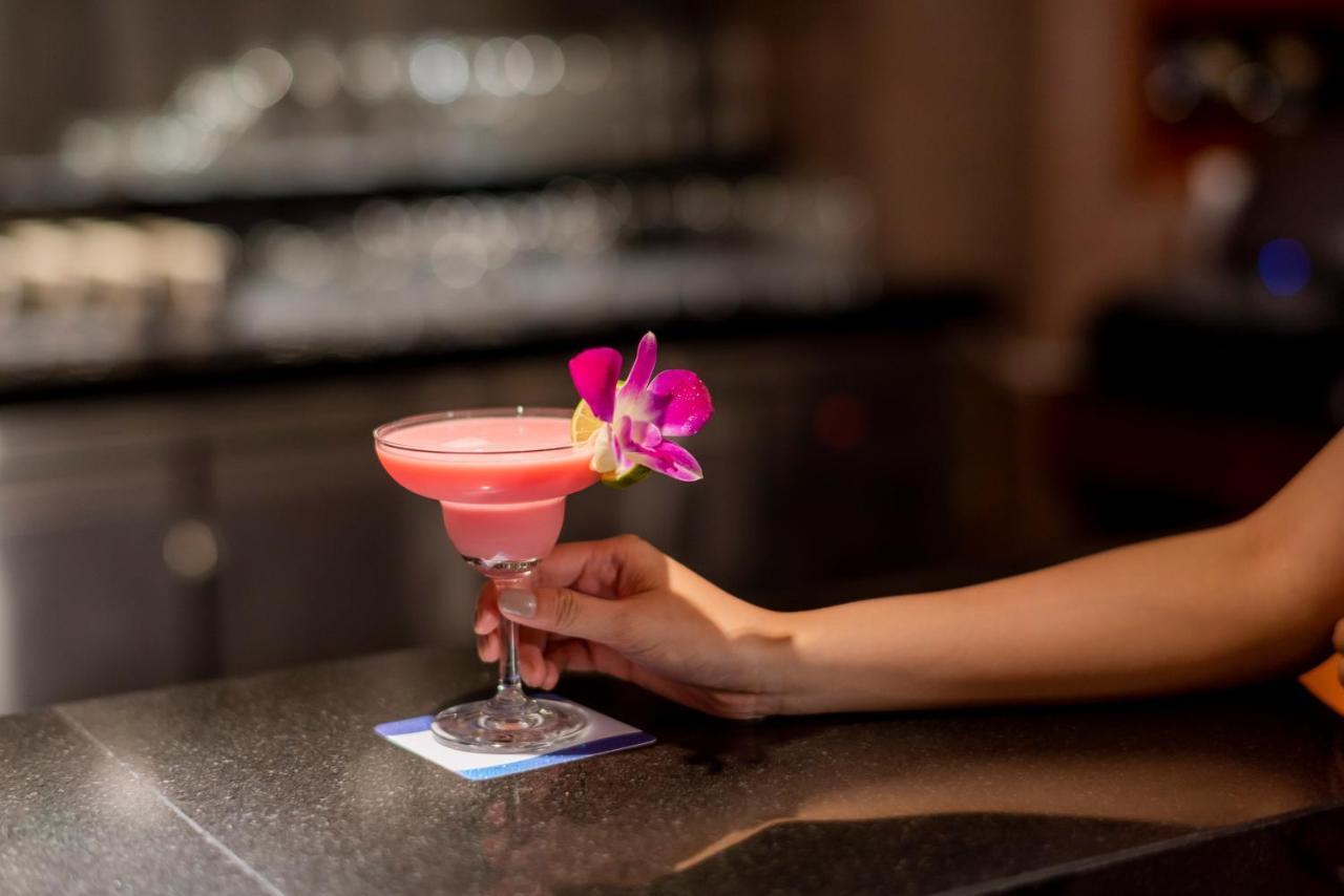 The Empress Premier Chiang Mai - Sha Extra Plus Exterior photo A cosmopolitan garnished with a lime and an orchid